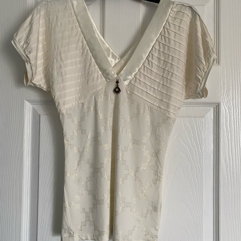 Elegant cream top with gold shimmer size medium